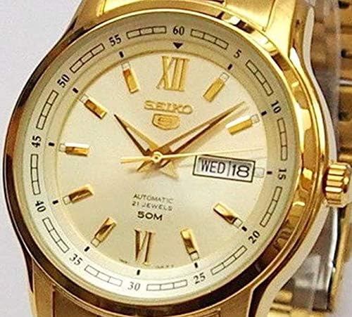 کلوز اپ view of the SEIKO 5 Automatic Watch SNKP20K1S champagne dial, showing gold-tone hour markers, hands, and the day/date window.