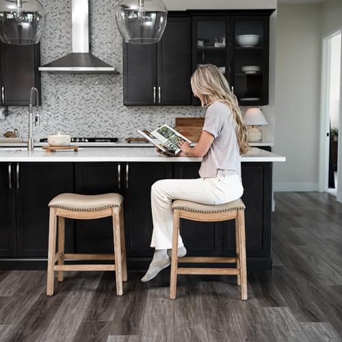 Image of Maven Lane Adrien Backless Counter Stool - Set of 3 - 26 Inches - Saddle Stool with Footrest - Brown Solid Wood Frame & Beige Faux Leather Upholstery - Perfect for Kitchen Islands & Counters