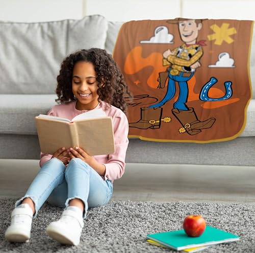 Image of Jay Franco Plush Throw Blanket - 46 inch x 60 inch Inches Kids Hero Soft & Cozy Fleece Throw for Bedroom & Couch Decor, Official Licensed Product, Brown - Toy Story Woody