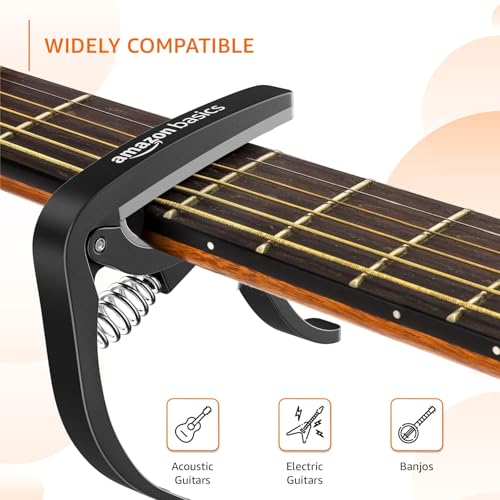 Image of Amazon Basics Guitar Capo with Pin Remover | Heavy Duty ABS Material | Versatile Fit | For Acoustic & Electric Guitar, Ukulele and Banjo | Buzz Free (Black)