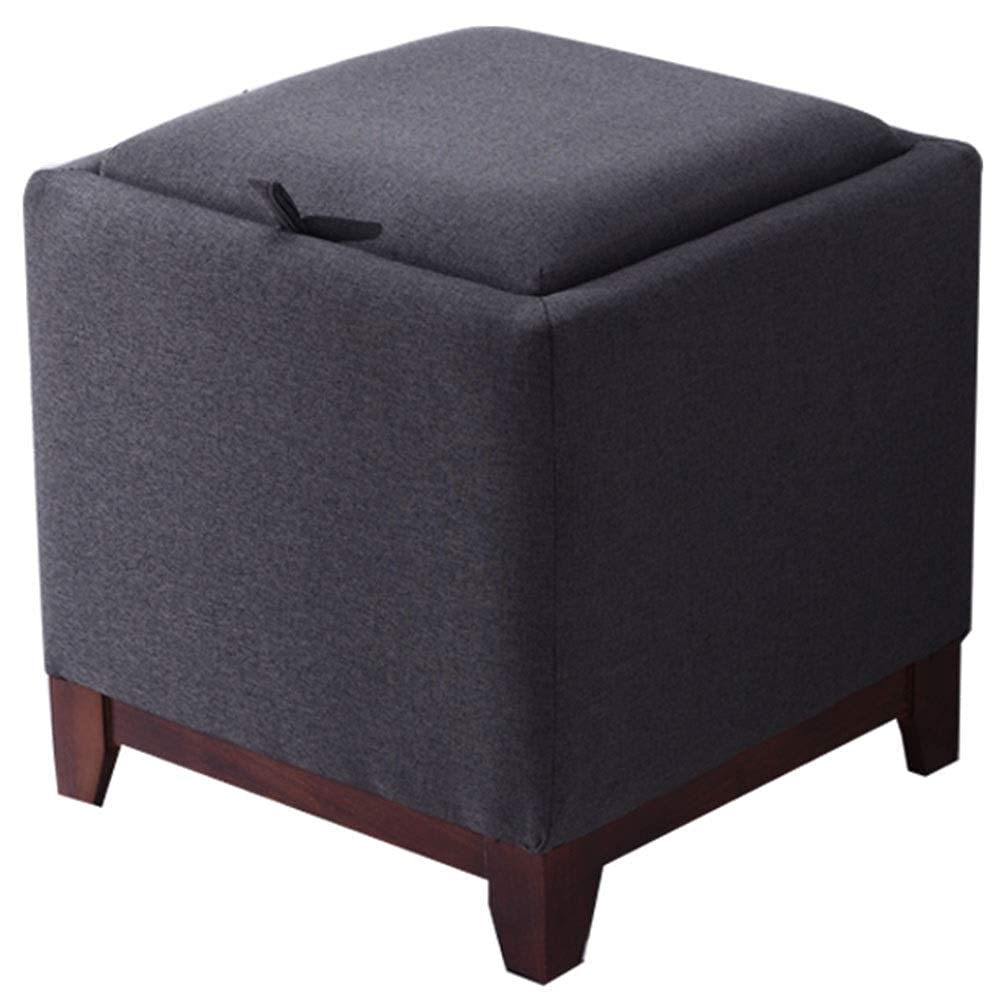Pouf repose-pieds gris pour ranger les plaids du salon avec élégance