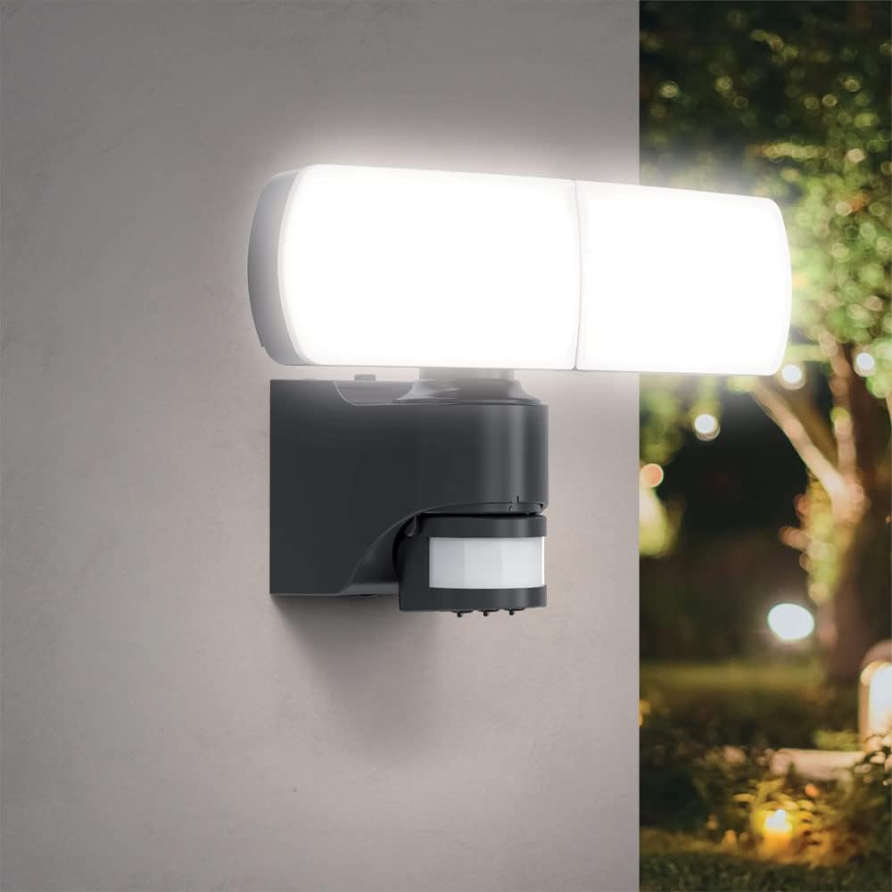 Xanlite Solar LED Wall Floodlight installed on a wall, illuminating an outdoor area at night.