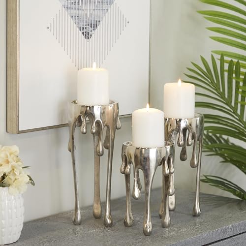 Image of CosmoLiving by Cosmopolitan Aluminum Metal Abstract Decorative Candle Holder Melting Drip Candle Stand, Set of 3 Candlestick Holder 12 inch, 10 inch, 8 inchH, Silver
