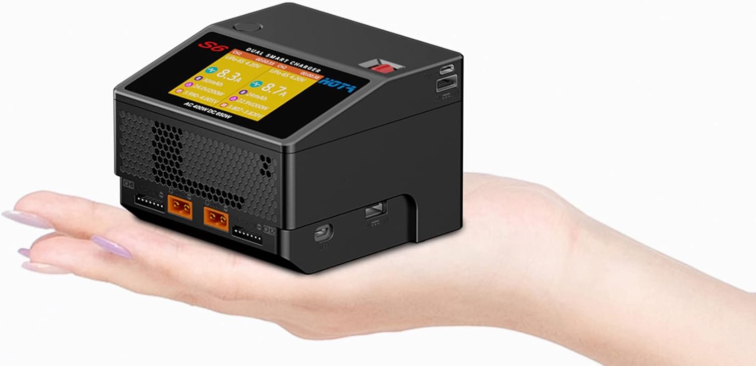 HOTA S6 Dual Smart Charger held in hand, showing compact size