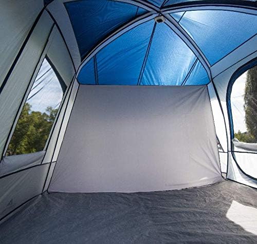 Interior view of the tent showing a room divider separating two sections.