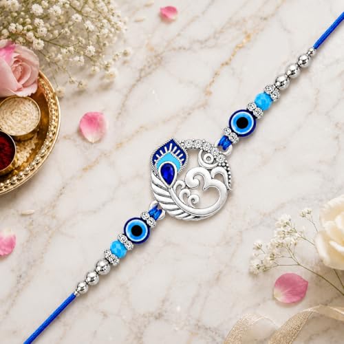 Image of Riddhika Ventures Religious Meenakari Om and Peacock Feather Rakhi With Roli Chawal And Greeting Card