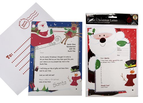 Carta de respuesta de Papá Noel y Papá Noel en un paquete de regalo con sobres