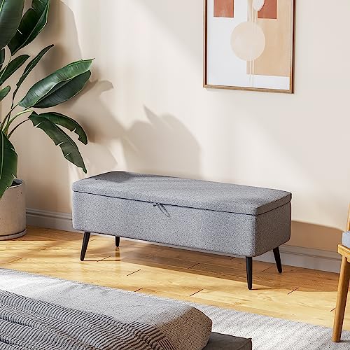 Banc de rangement compact gris avec coffre pour optimiser les petits espaces