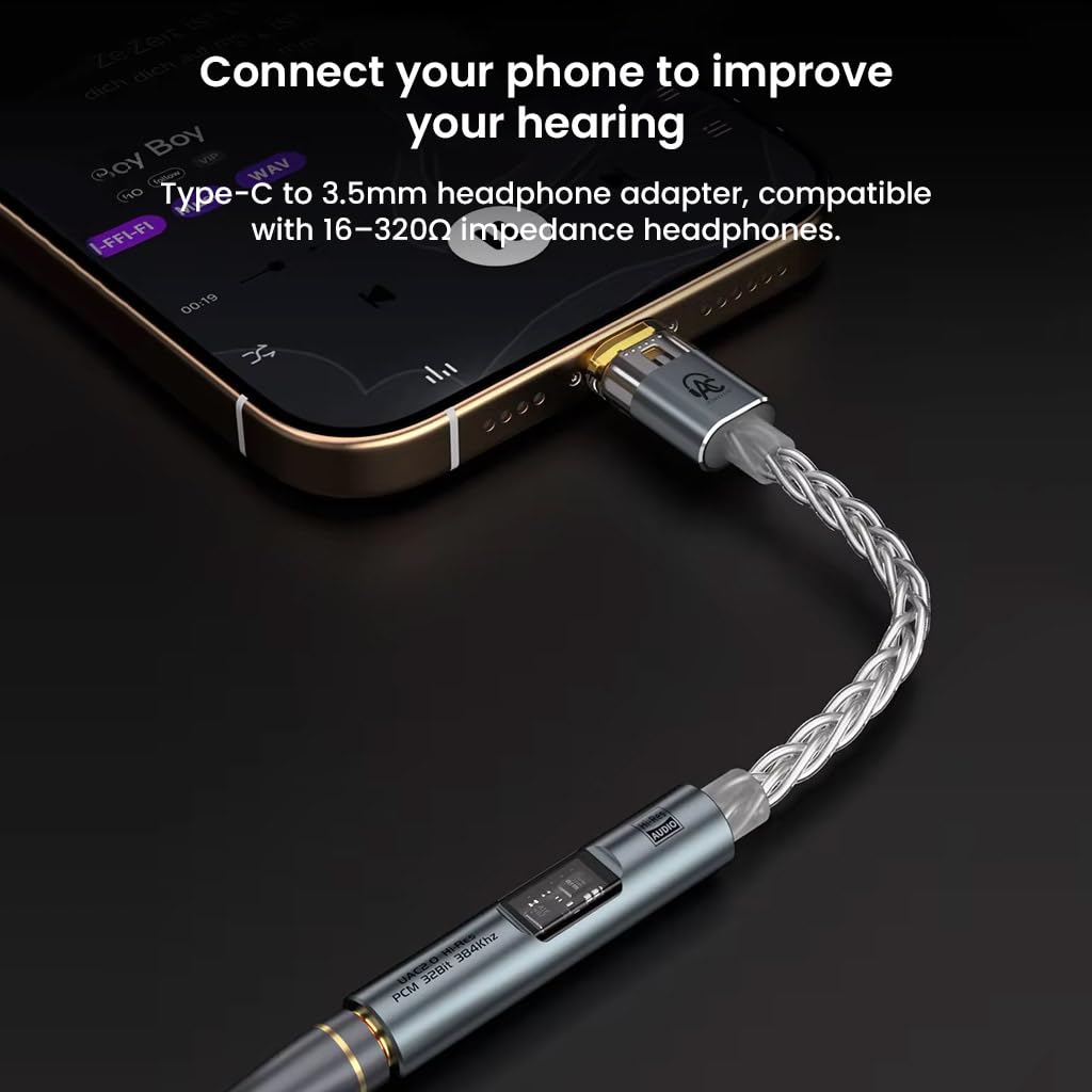 AUDIOCULAR SPARK DAC Dongle being placed into a pocket, demonstrating its portability