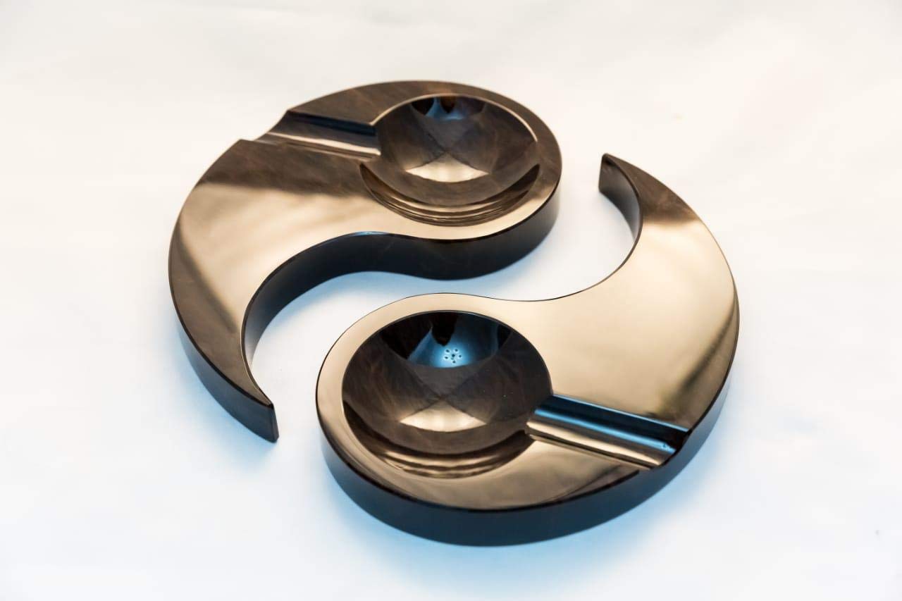 In style of Yin and Yang scigar ashtray. Made from Obsidian stone.
