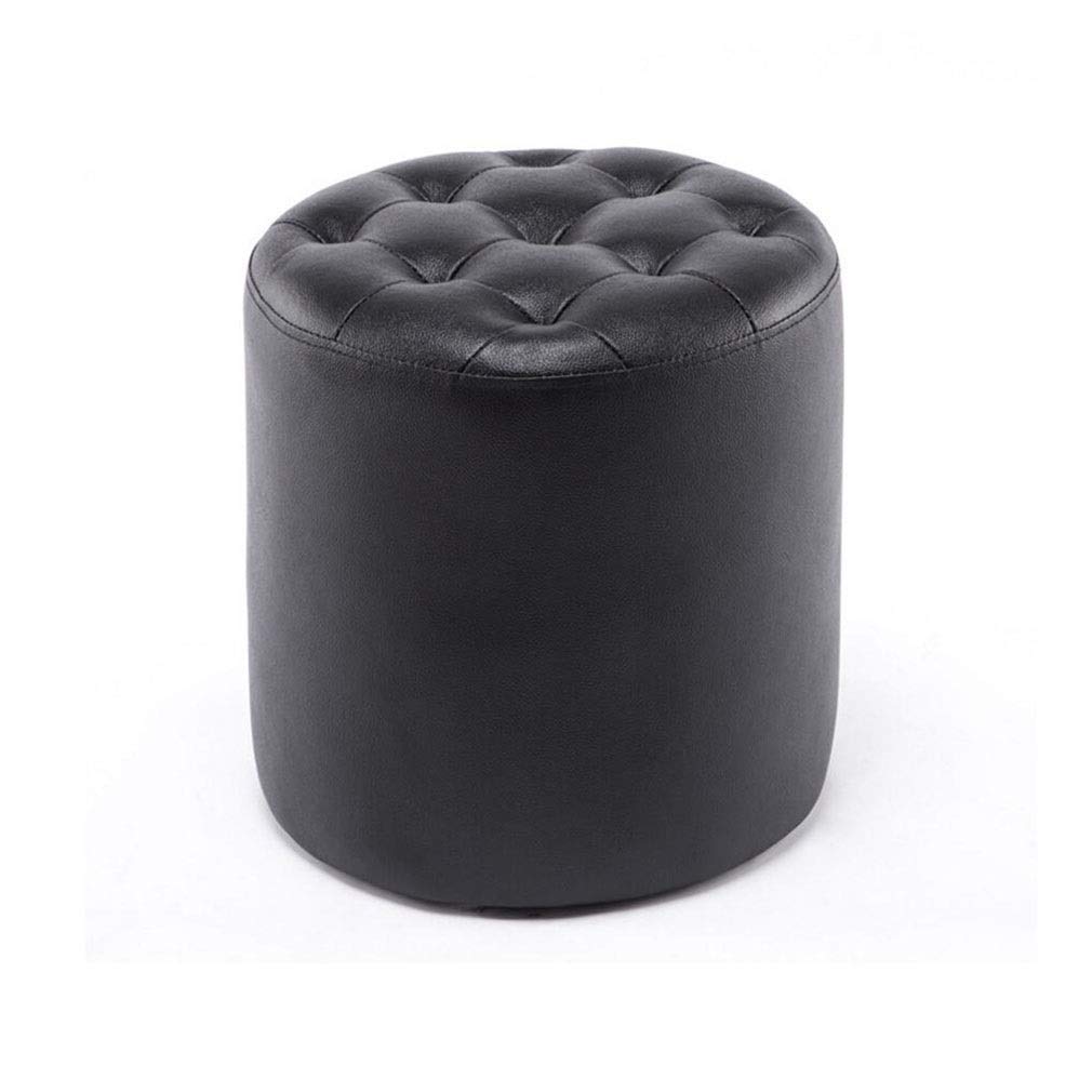 Pouf repose-pieds rond en cuir noir pour salon chaleureux et cocooning