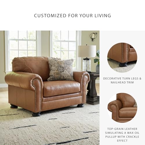Image of Signature Design by Ashley Carianna Oversized Leather Accent Chair, Caramel | Top-grain leather seating, Durable faux leather outer panels, Extra-wide 54 in frame, Traditional living room style