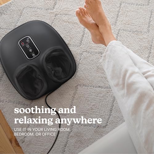 Shiatsu foot massager used while sitting during the final minutes of an after-work transition.