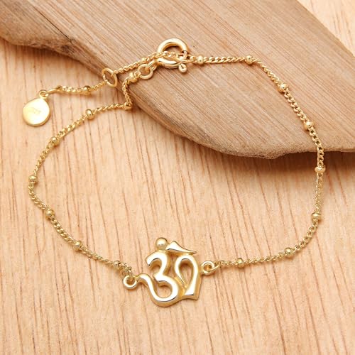NOVICA Artisan Handmade Gold Plated Sterling Silver Pendant Bracelet Om Indonesia Buddhism Hinduism Yoga Spiritual Inspirational [6.75 in min L x 8 in max L 1 mm W Pendant(s) 0.6 in L x 0.6]4
