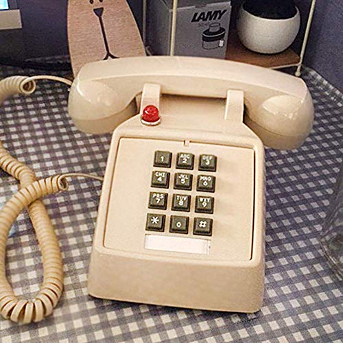 Téléphone fixe ancien filaire blanc doté de la recomposition du numéro
