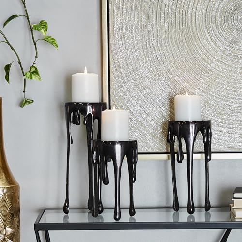 Image of CosmoLiving by Cosmopolitan Aluminum Metal Decorative Candle Holder Pillar Candle Stand with Dripping Melting Designed Legs, Set of 3 Candlestick Holder 12 inch, 10 inch, 8 inchH, Black