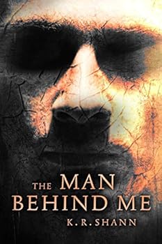 Paperback The Man Behind Me Book