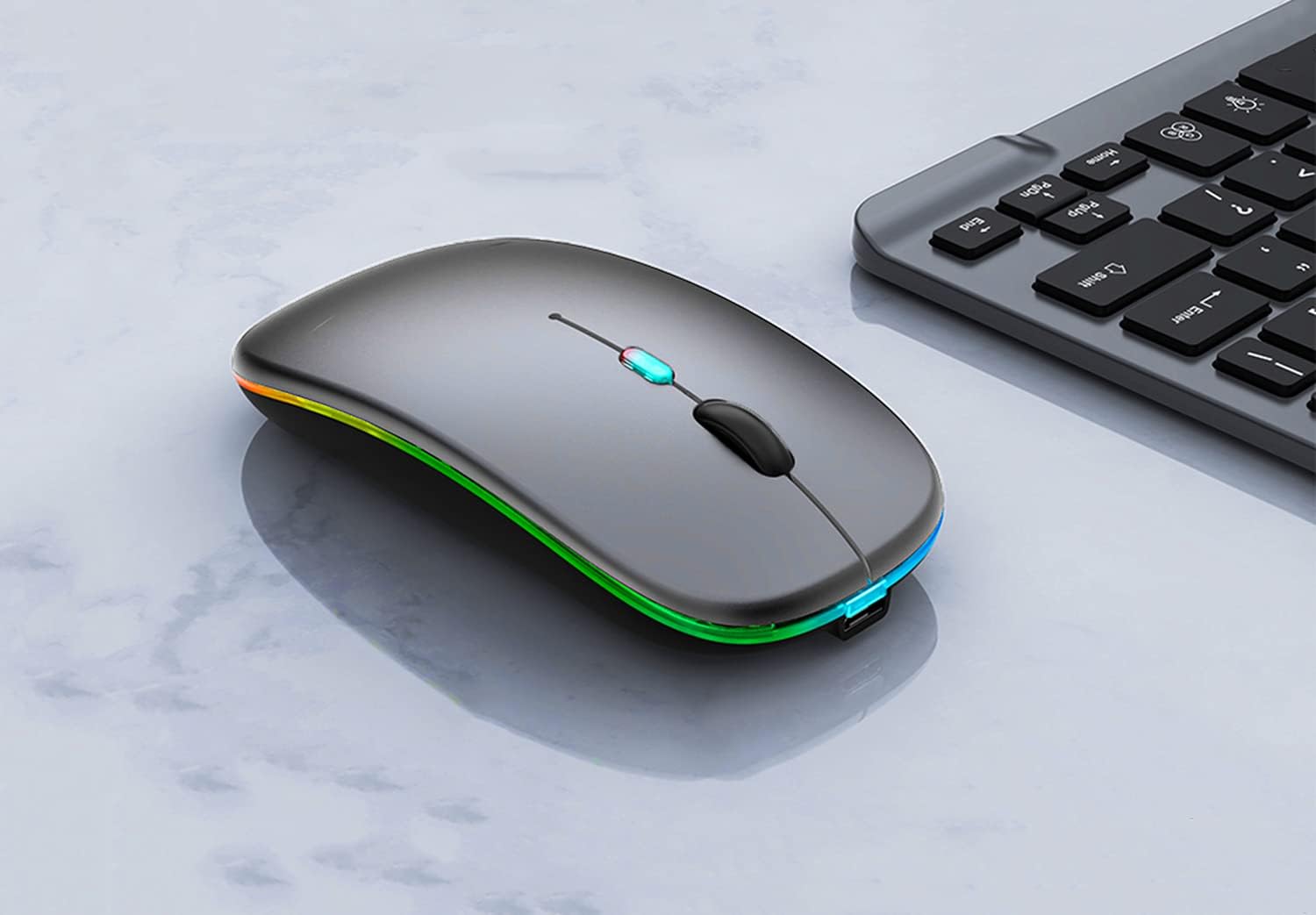 WREANU Wireless Bluetooth Mouse connected to a charging cable.