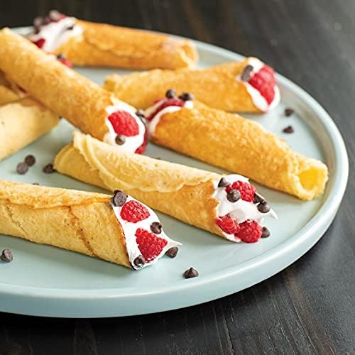 Krumkake cones filled with cream and raspberries on a plate