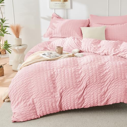 Image of HYMOKEGE Pink Oversized King Comforter Set Seersucker 7 Pieces, All Season Luxury Bed in a Bag for Bedroom, Bedding Set with Comforter, Sheets, Pillowcases & Shams