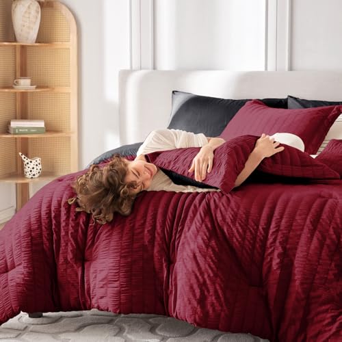 Image of MUXHOMO 7 Pieces Oversized King Comforter Set, Seersucker Bed in a Bag Oversized King Size, All Season Luxury Bedding Set with Comforter, Flat Sheet, Fitted Sheet, Pillowcases & Shams, Red & Black