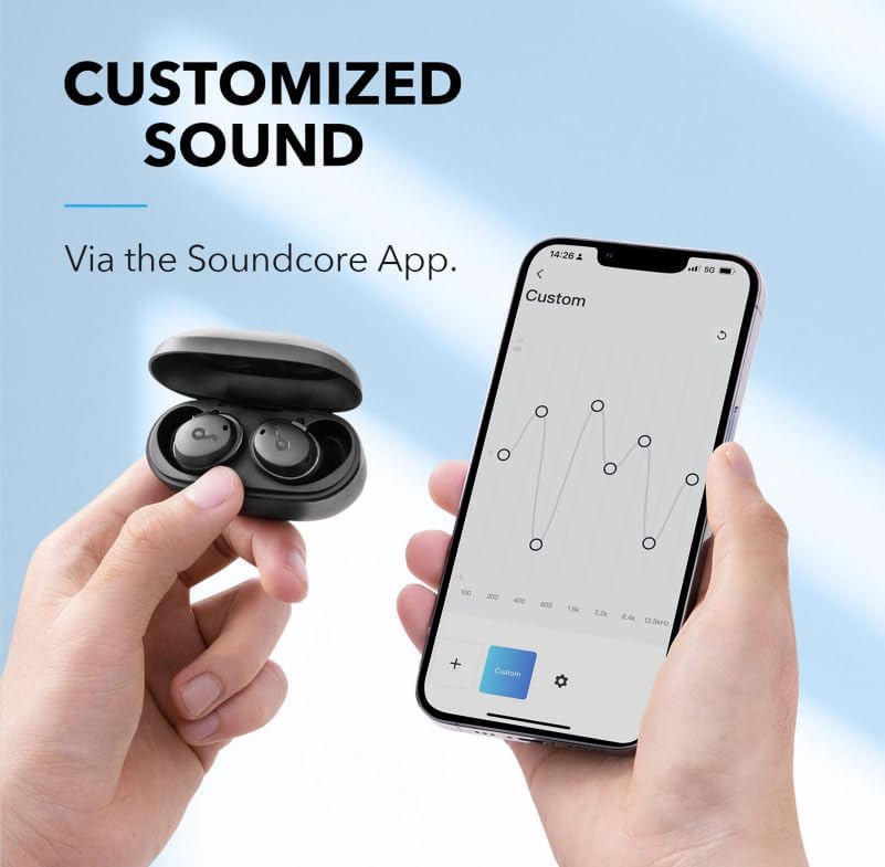 Hands holding a smartphone displaying the Soundcore app with EQ settings, next to the charging case