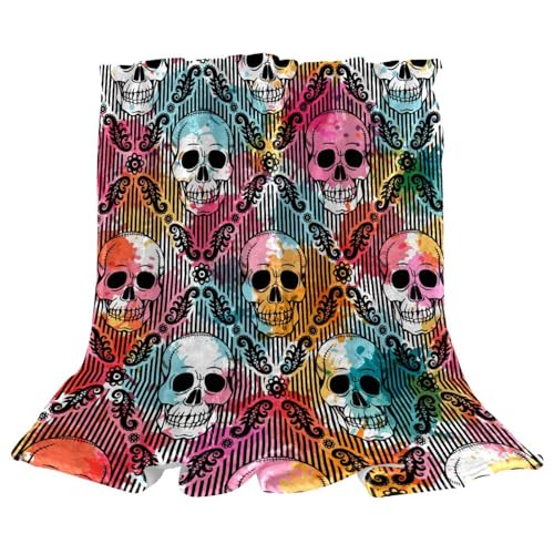 Couverture polaire tête de mort pour soirées cocooning canapé