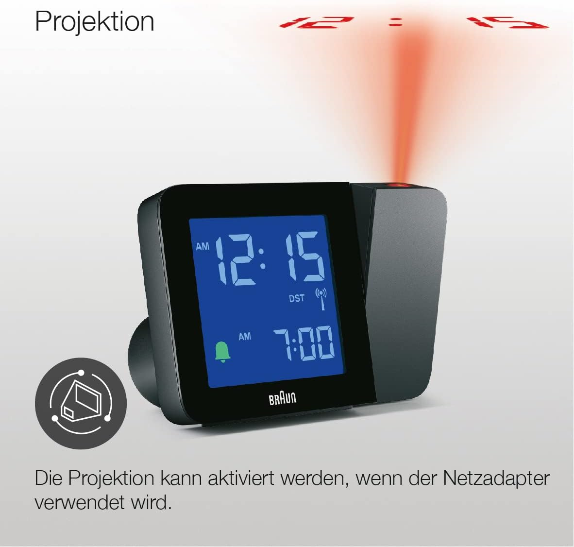 Close-up of the Braun alarm clock showing the projection lens and the projected time '12:15' in red on a surface.
