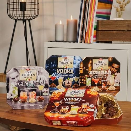 Edle Tropfen in Nuss Vodka Lounge 100g, flüssig gefüllte Schokoladenpralinen mit Milchschokoladen-Überzug und knackigen Haselnuss-Splittern