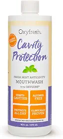 Oxyfresh Enxaguante bucal com flúor com proteção contra cavidades – Enxaguante bucal anticavidade para dentes sensíveis – sem manchas, sem álcool – Hálito fresco duradouro. 473 ml.