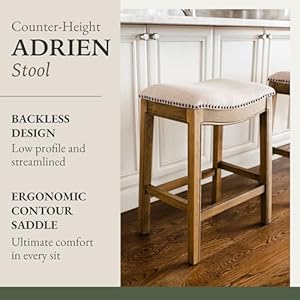 Maven Lane Adrien 26 Inch Counter Height Upholstered Backless Saddle Barstool in Natural Wood Finish with Wheat Cream Fabric Cushion Seat Maven Lane Adrien 26 Inch Counter Height Upholstered Backless Saddle Barstool in Natural Wood Finish with Wheat Cream Fabric Cushion Seat