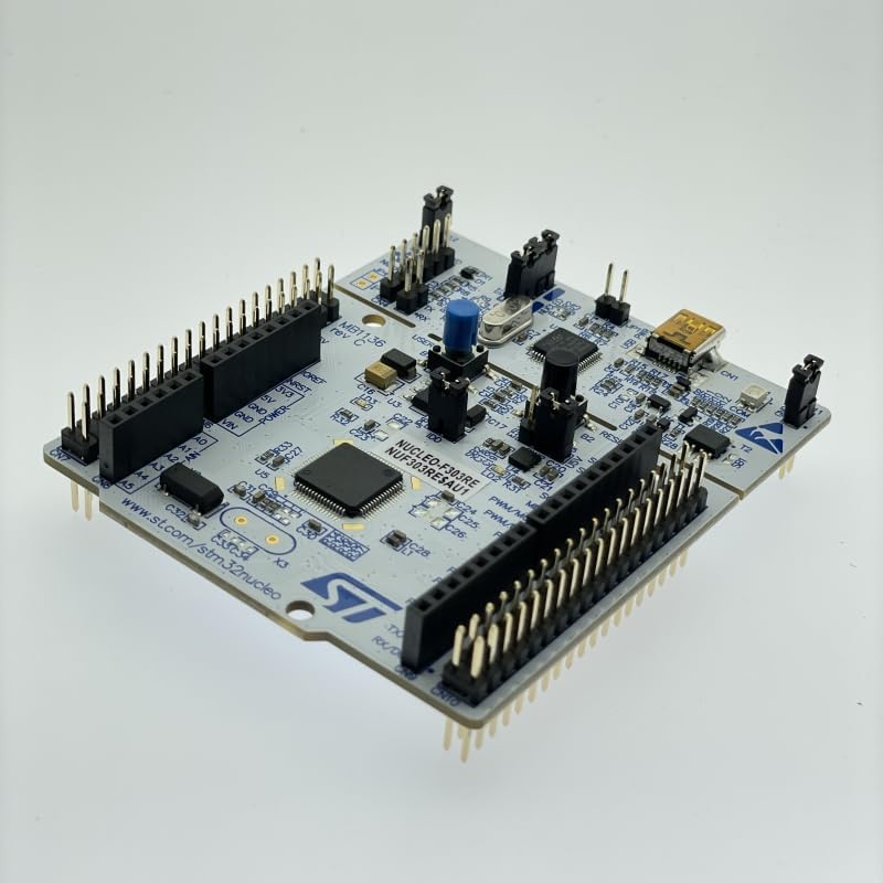 Product packaging for the STM32 Nucleo-64 Development Board, displaying model number NUCLEO-F303RE, manufacturing details, and compliance certifications like RoHS, CE, and FCC.
