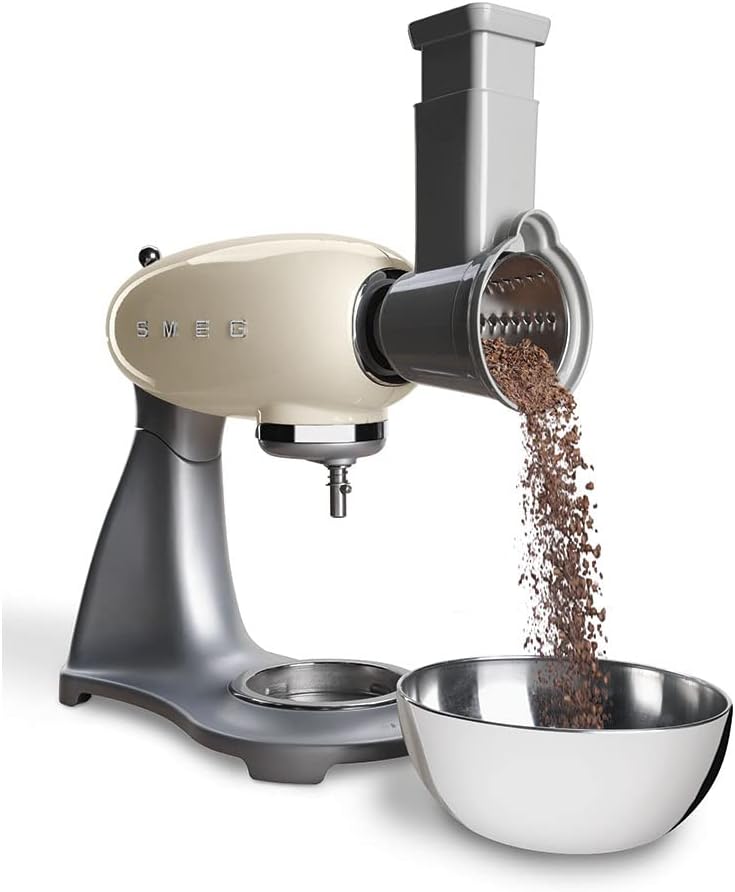 SMEG Stand Mixer with Slicer Attachment processing carrot slices into a bowl.