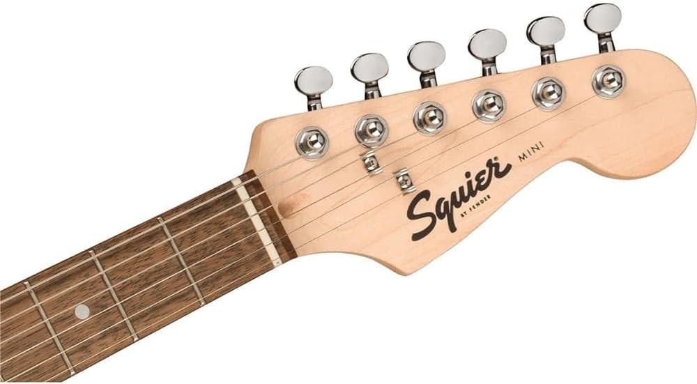 Squier Mini Stratocaster Electric Guitar- Shell Pink Bundle with Fender Professional Instrument Cable (10ft), Logo Guitar Strap and Classic Celluloid Guitar Picks 12-Pack