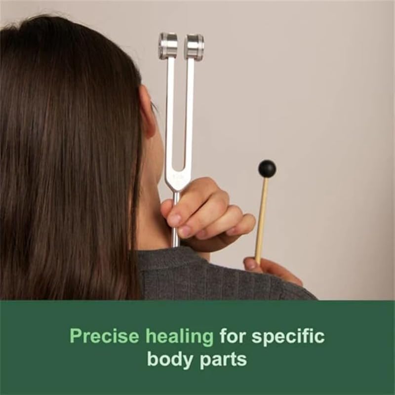 A person holding a vibrating 128 Hz tuning fork near their neck, demonstrating a common application method.