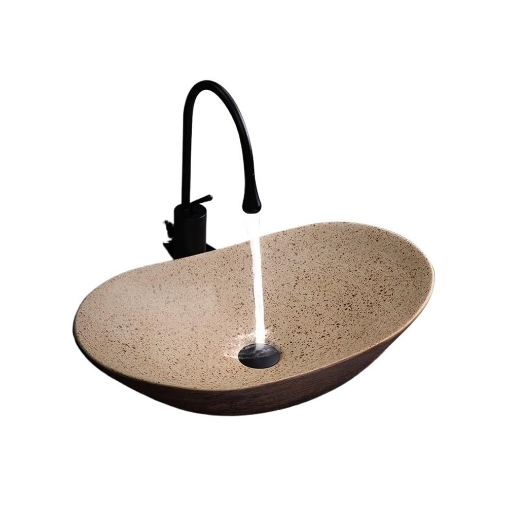 Lavabo de baño retro con grifo monomando y válvula de desagüe sobre encimera