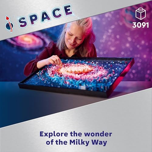 A person assembling one of the panels from the LEGO Art Milky Way model kit