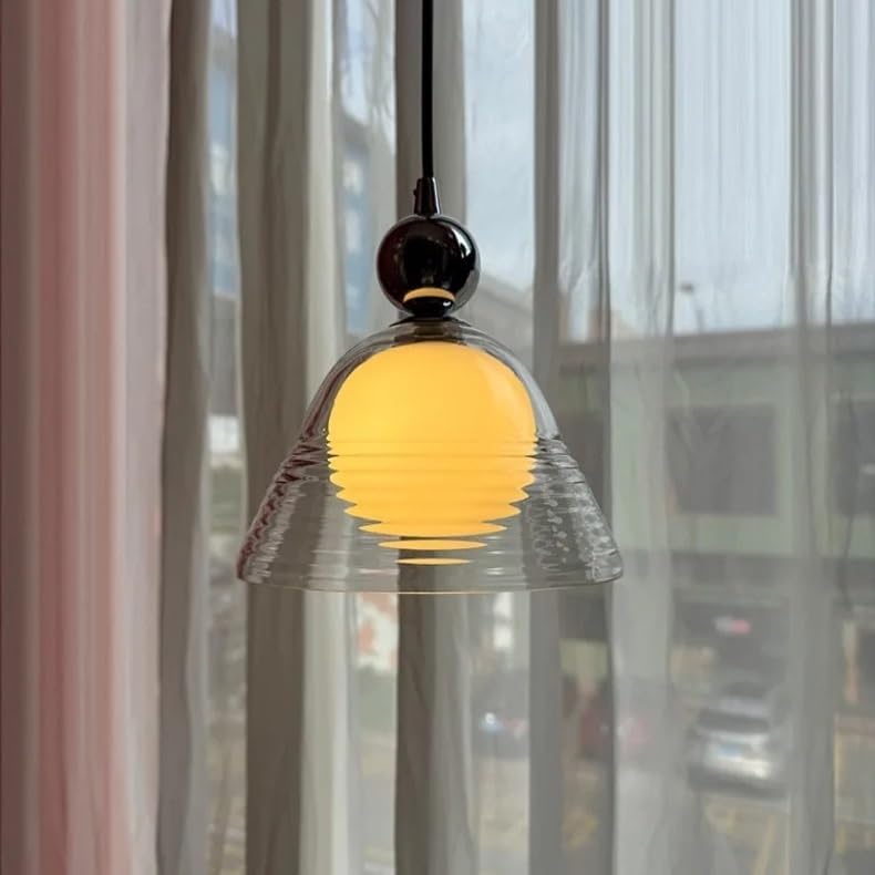 Luminaires suspendus sunset en verre contre la lumière agressive de chambre