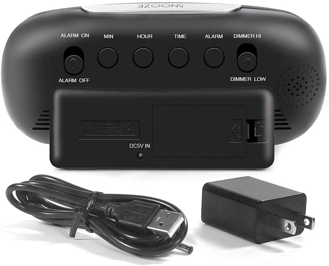 Rear view of Housbay Digital Alarm Clock showing control buttons, DC 5V IN port, and battery compartment.