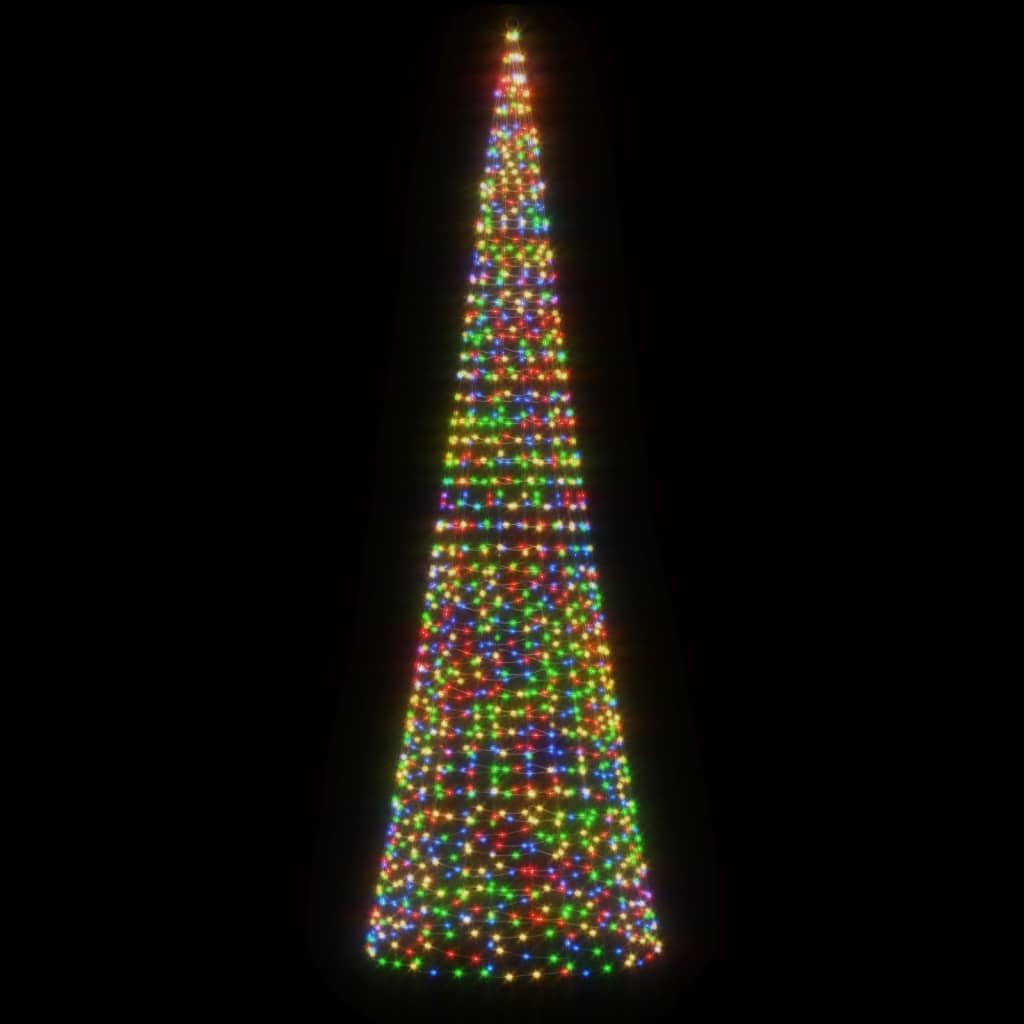 The vidaXL Christmas Tree Light Cone illuminated with colorful LED lights at night, positioned outdoors in front of a house, demonstrating its festive appearance.