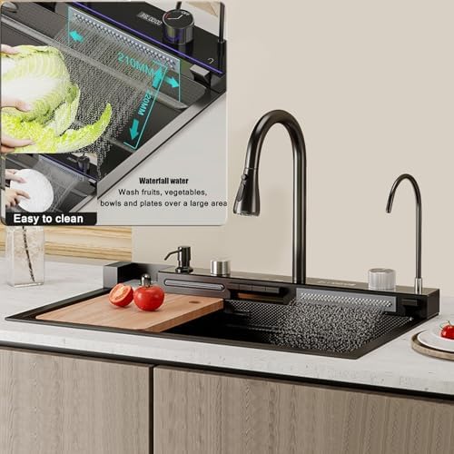 Overhead view of the sink in use, showing vegetables being washed under the waterfall feature and the easy-to-clean surface.