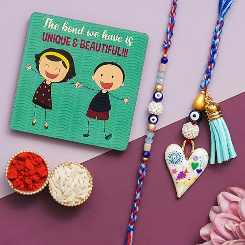 Image of Rakhi for brother and bhabhi Set of 1 Lumba Rakhi, 1 Fridge Magnet With Roli Chawal Set and Greeting Card