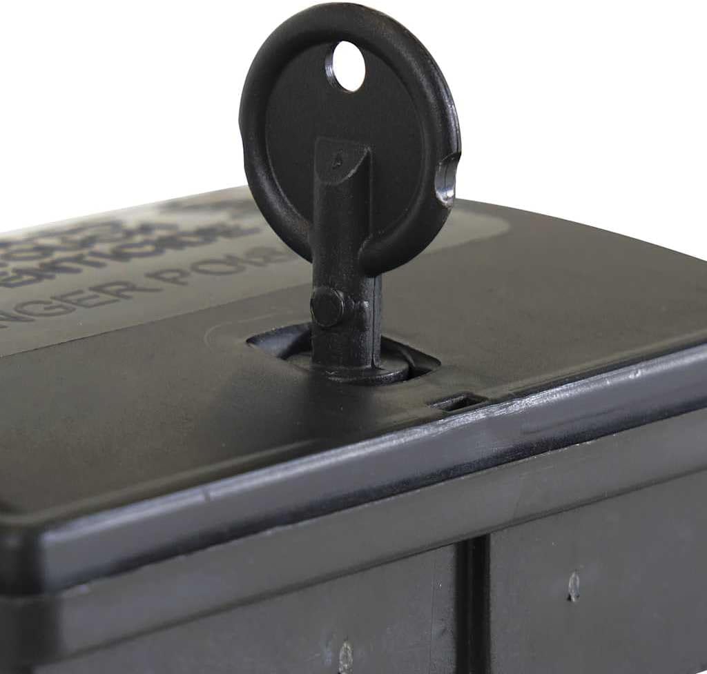 Close-up of the key inserted into the bait station lock