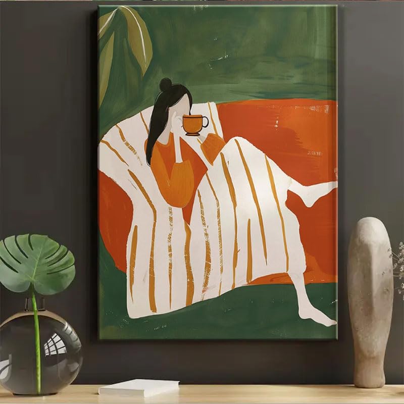 Lienzo de mujer tomando café que inspira paz y calidez en la decoración de tu casa