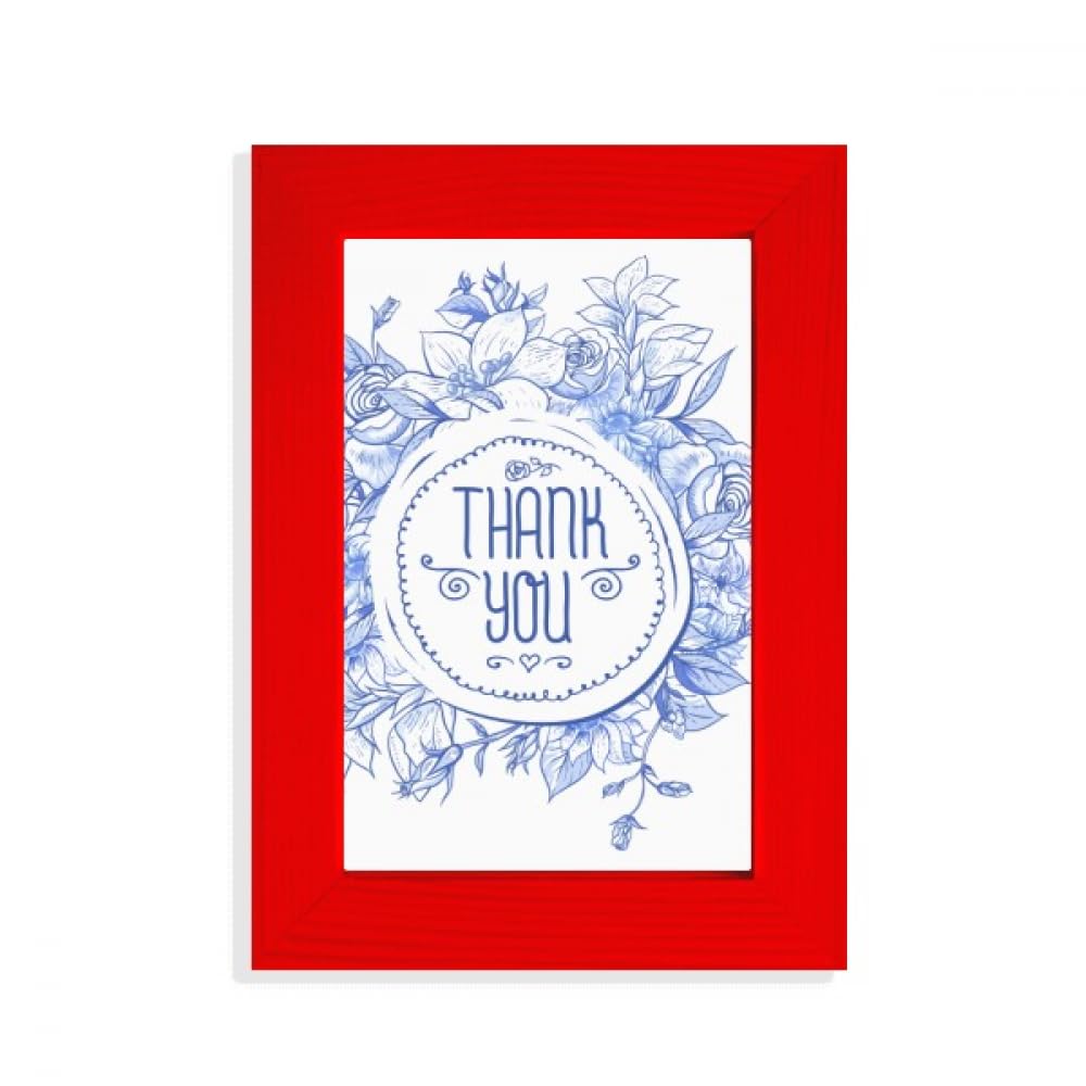 Cadre photo rouge et roses bleues pour rompre la monotonie des murs