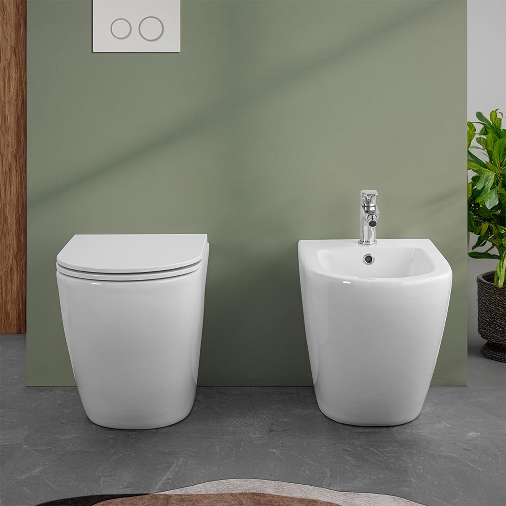 Sanitari filomuro in ceramica bianco lucido con brida e scarico traslato a parete o pavimento, sedile originale soft-close con sgancio rapido, linea FLAN
