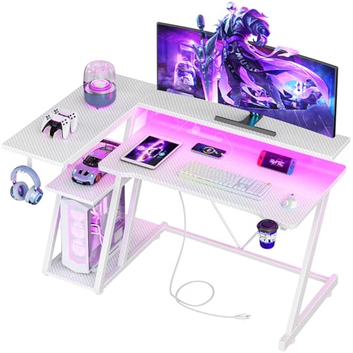 Image of Korfile 40 Inch Gaming Desk with Power Outlet & LED Lights, L Shaped Computer Gaming Table with 3 Tiers Storage Shelves, Corner Gamer Desk with Monitor Stand for Small Space, Carbon Fiber White