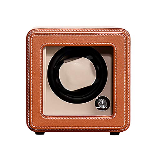 Caja de devanado automático de cuero marrón, ideal para organizar relojes en el dormitorio.