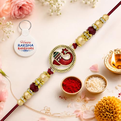 Image of Riddhika Ventures Religious Gold Plated Meenakari Sacred Ganesha Rakhi with Roli Chawal and One Happy Raksha Bandhan Keychain