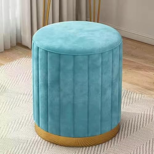 Otomana de terciopelo azul con base chapada